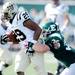 Western Michigan sophomore Tevin Drake attempts to out run  Eastern Michigan sophomore Colin Weingrad during the first quarter against Western Michigan at Rynearson Stadium on Saturday afternoon. Melanie Maxwell I AnnArbor.com